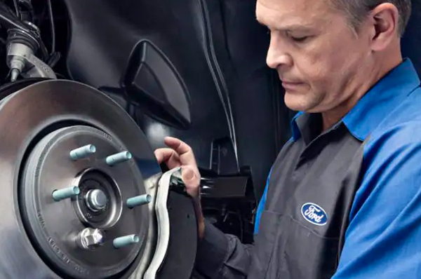 Bison Ford Service Offer - Motorcraft Brake Service Ford Tech Performing Brake Service