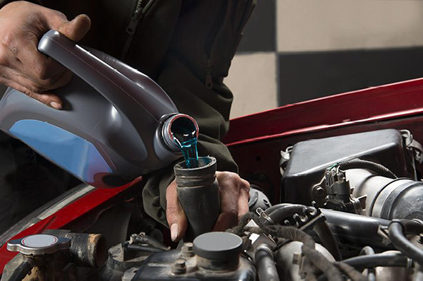 Kayser Ford Service Offer - Cooling System Flush Ford Tech Filling Coolant System
