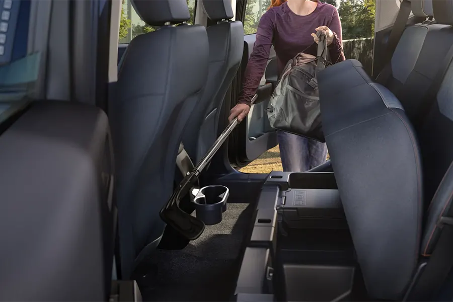 2022 Ford Maverick Design - Standard Rear-Seat Storage Lady grabbing bag from rear-seat storage