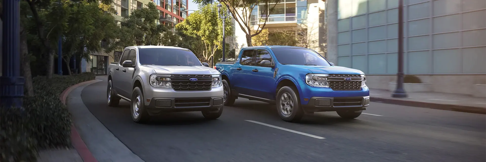 2022 Ford Maverick Performance 2 Mavericks driving down a city highway