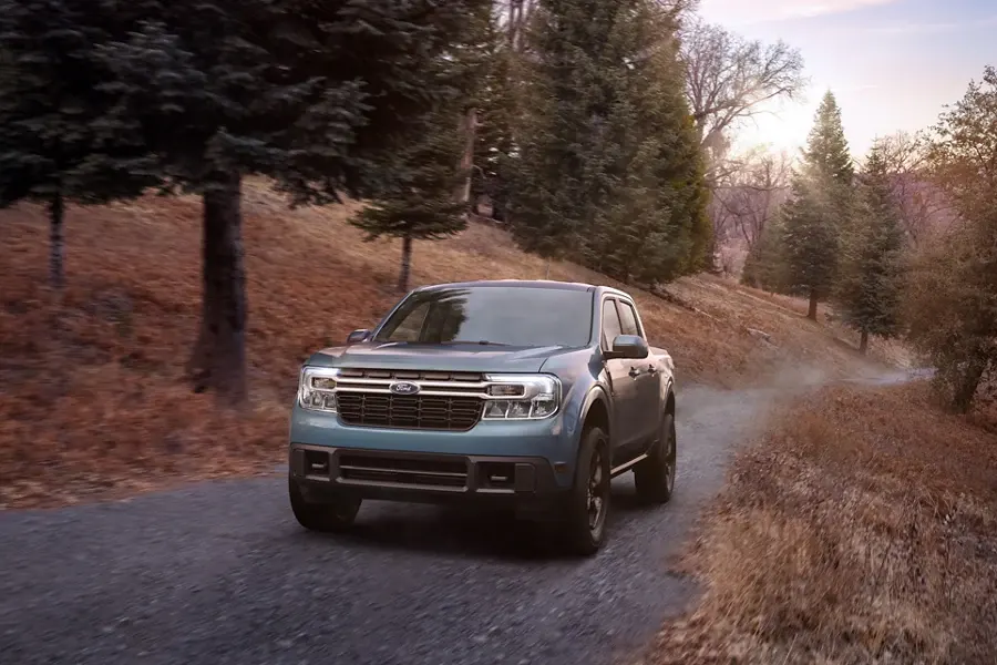 2022 Ford Maverick Performance - The First-Ever Standard Full Hybrid Pick Up Maverick driving down a dirt country road