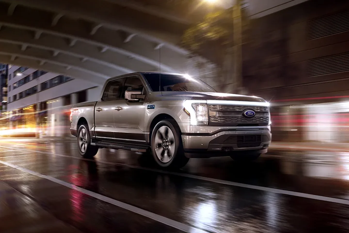 2024 Ford F-150 All-Electric F-150 driving down a dark highway