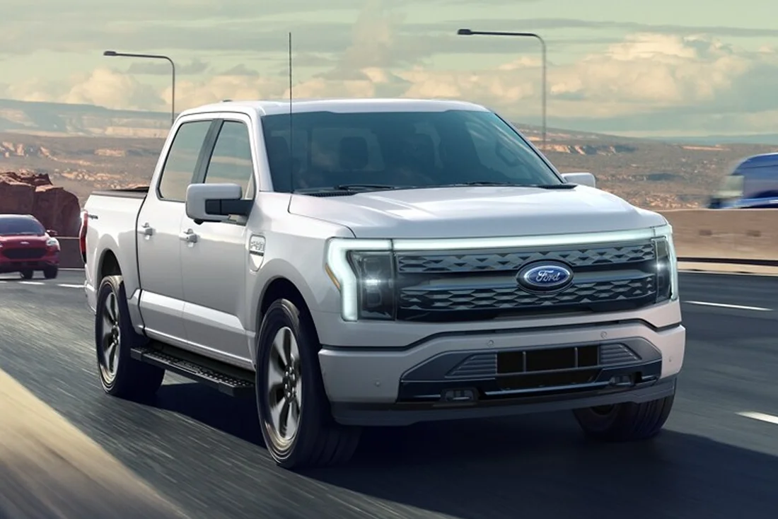 Ford F-150 Lightning Shown Ford F-150 Lightning driving down highway