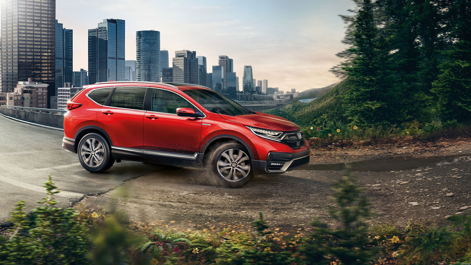 2021 Honda CR-V Capability Hybrid Touring with AWD shown in Radiant Red Metallic.