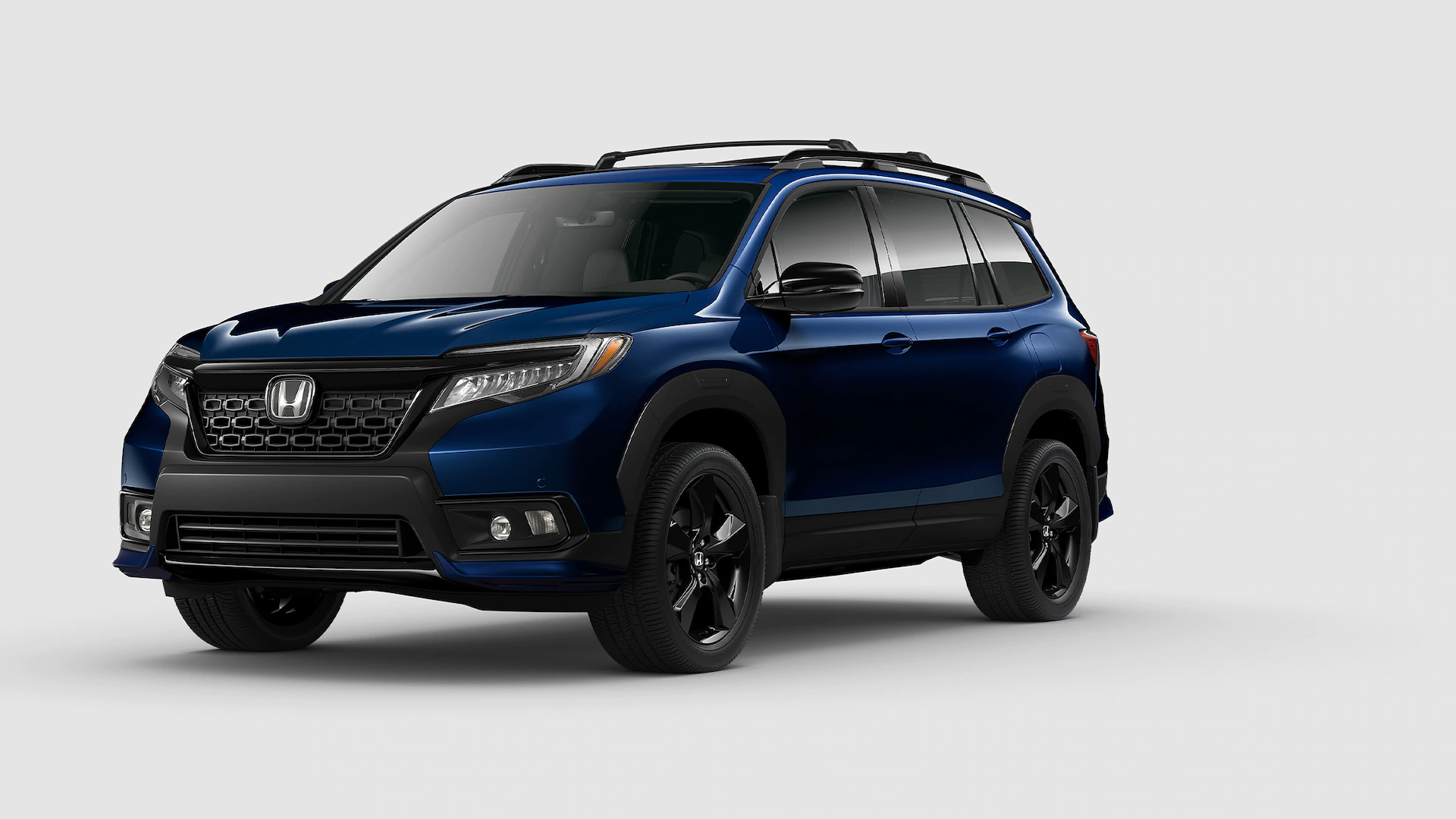 2021 Honda Passport Exterior Elite shown in Obsidian Blue Pearl with Honda Genuine Accessories. Urban Package available on Touring and Elite.
