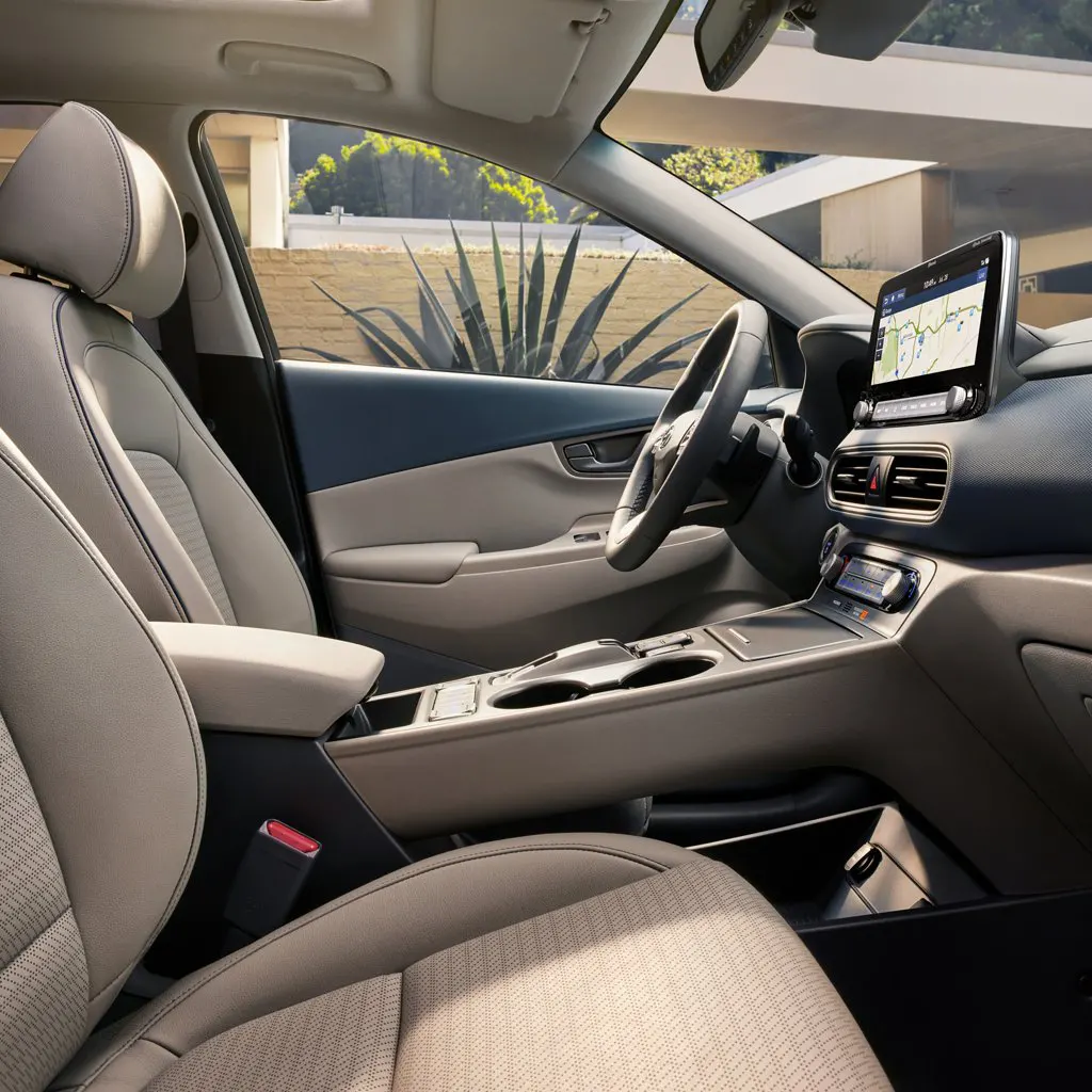 2021 Hyundai Kona - Design A female loading luggage in Kona trunk