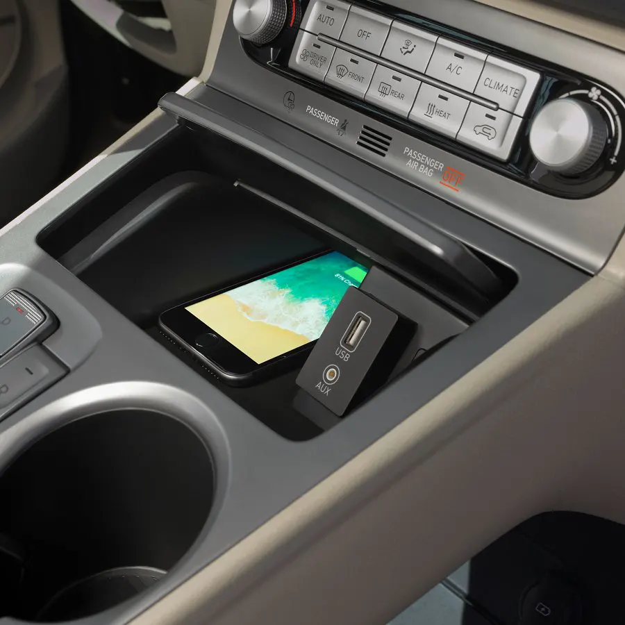 2021 Hyundai Kona - Technology Phone charging in center consoleCenter console touchscreen shown with apps
