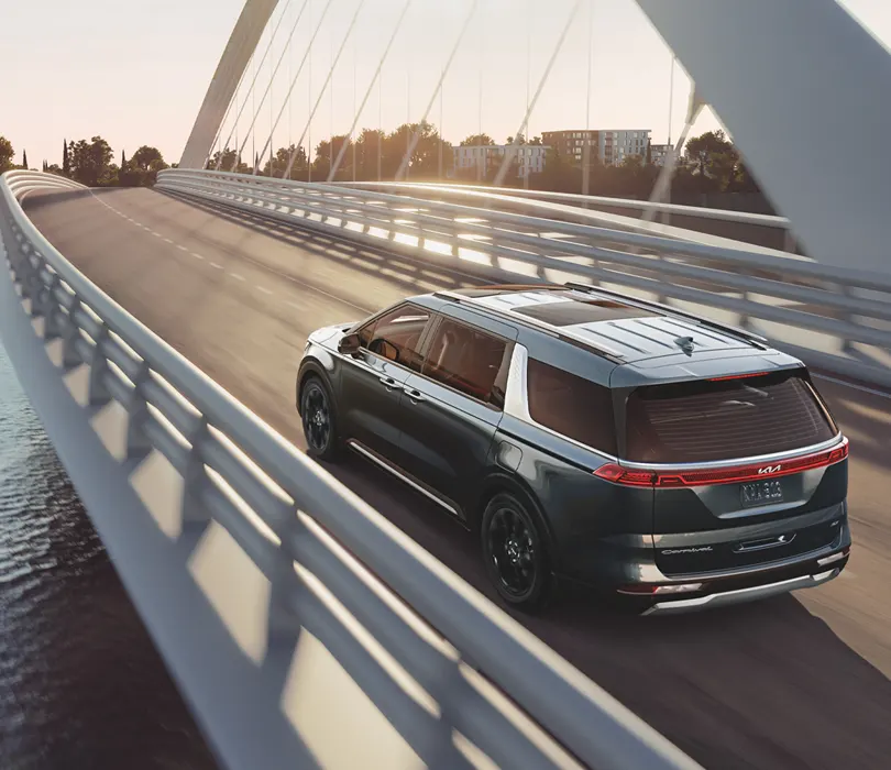 2022 Kia Carnival MPV - Performance, coming soon to Lev Kia of Framingham 2022 Kia Carnival MPV driving down sity highway