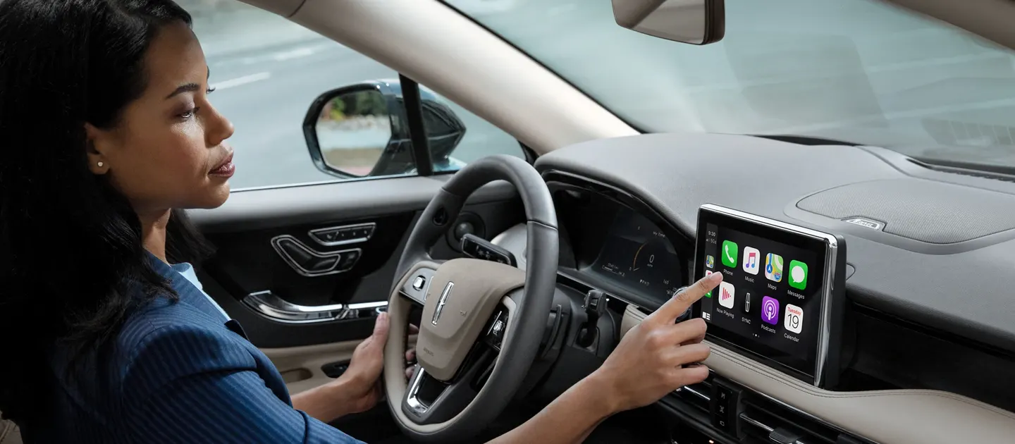 2021 Lincoln Corsair - Technology Woman choosing between the available apps