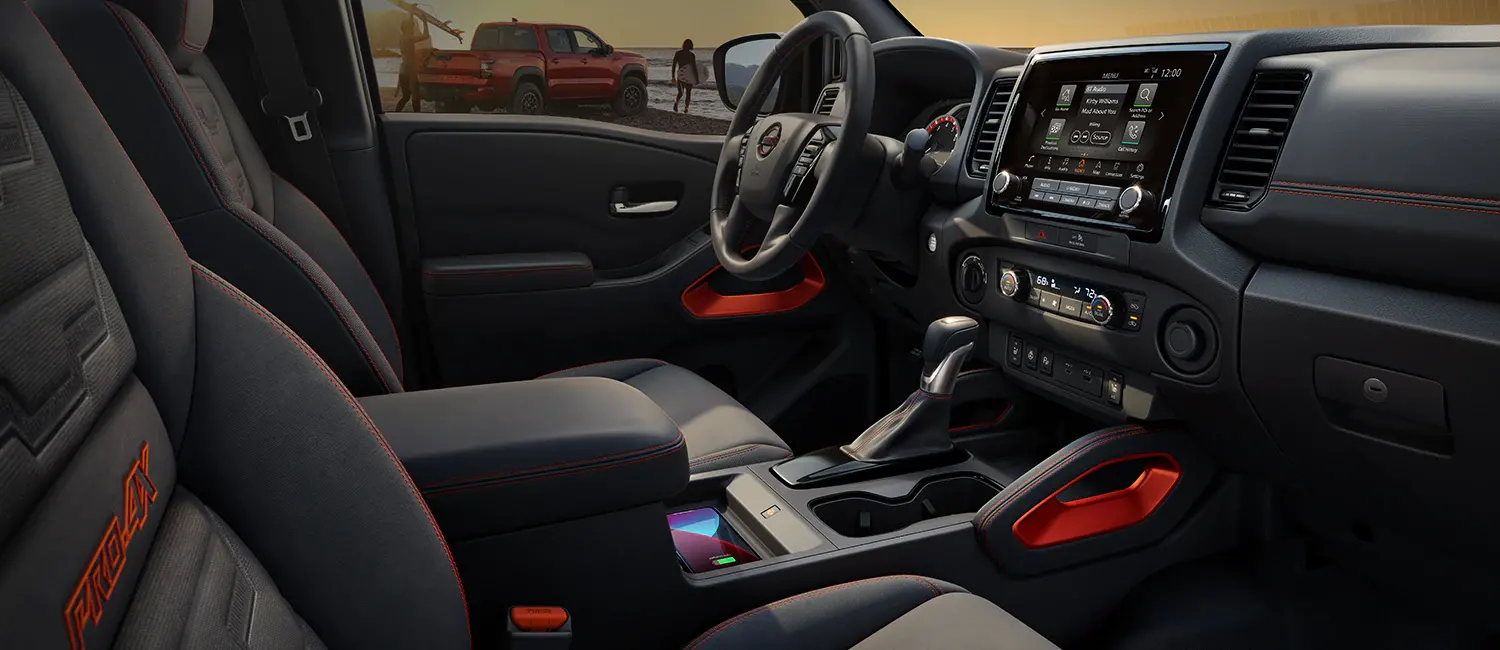 2022 Nissan Frontier Design Frontier interior shot from passenger seat at the beach