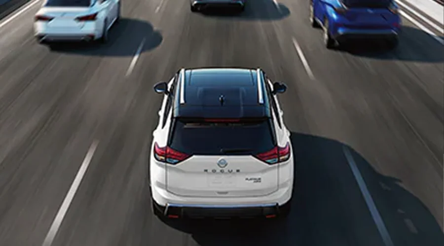 2025 Nissan Rogue - Performance 2025 Nissan Rogue Driving Down Highway