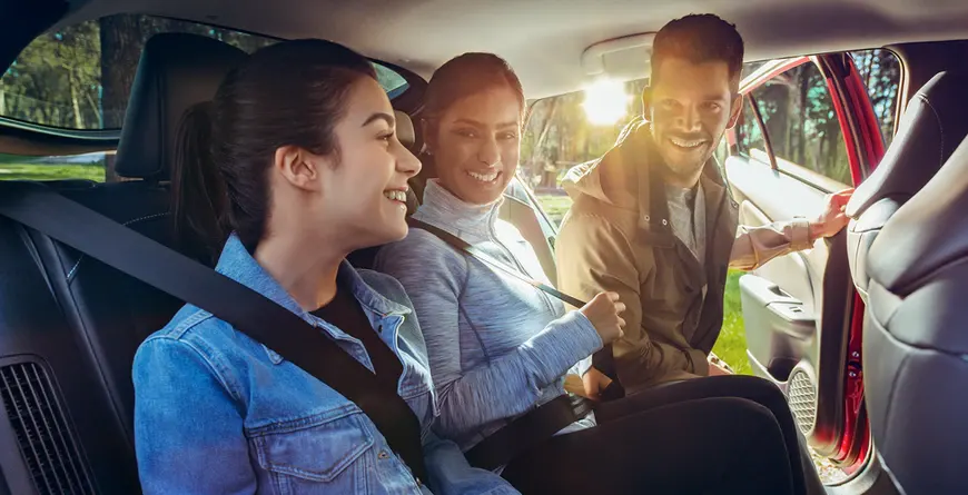 2021 Toyota Prius Prime Interior Family sitting in the back set of the 2021 Prius Prime