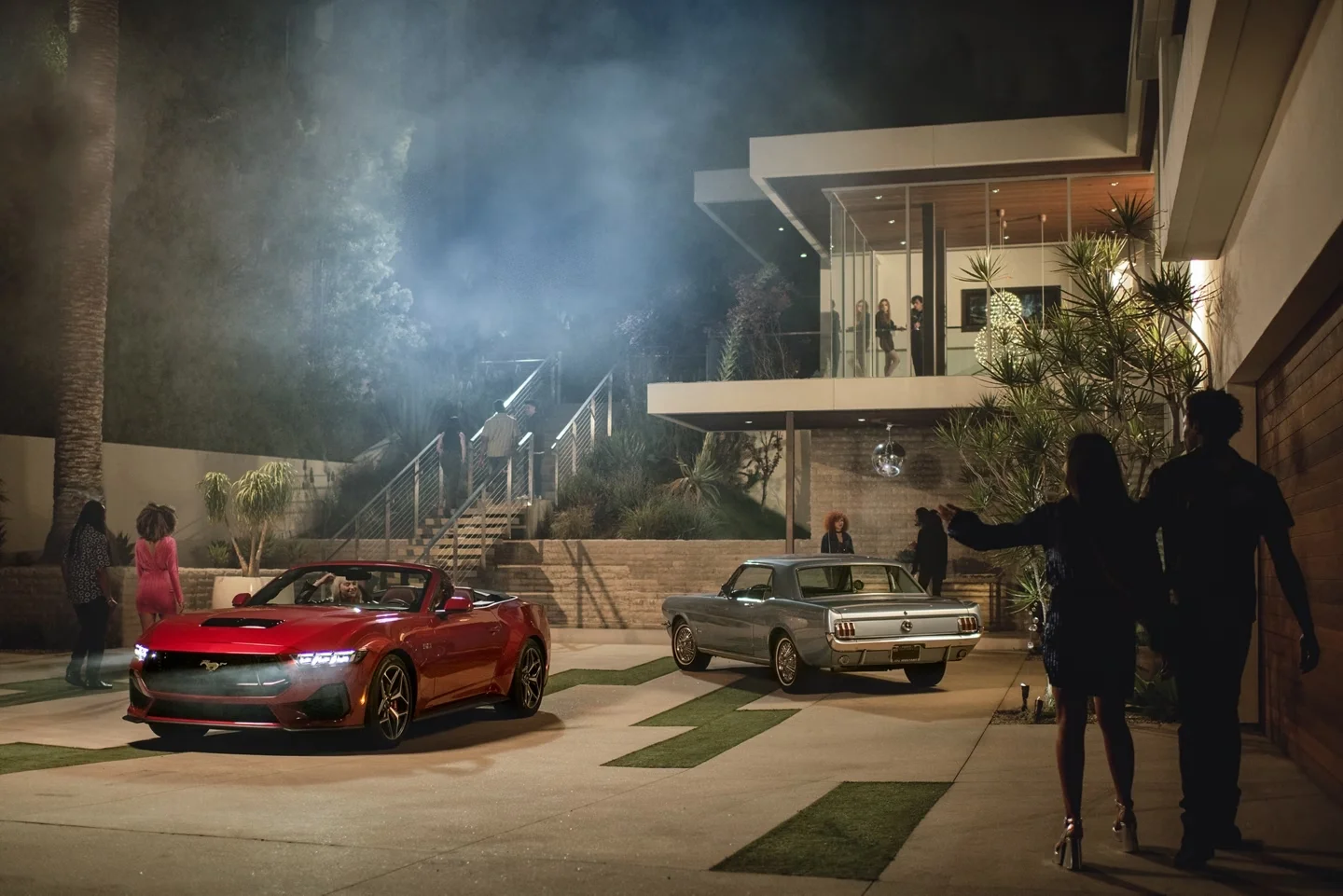 2024 Ford Mustang parked outside a house