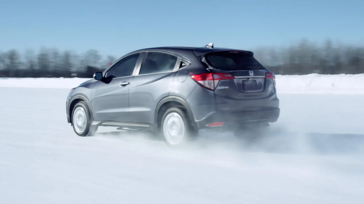 2021 Honda HR-V 2021 Honda HR-V driving through a snow field.
