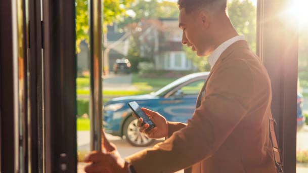 Man using app on phone as he walks outside