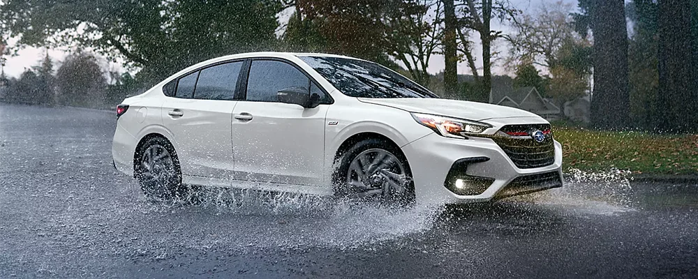 Legacy driving on slippery wet raod 