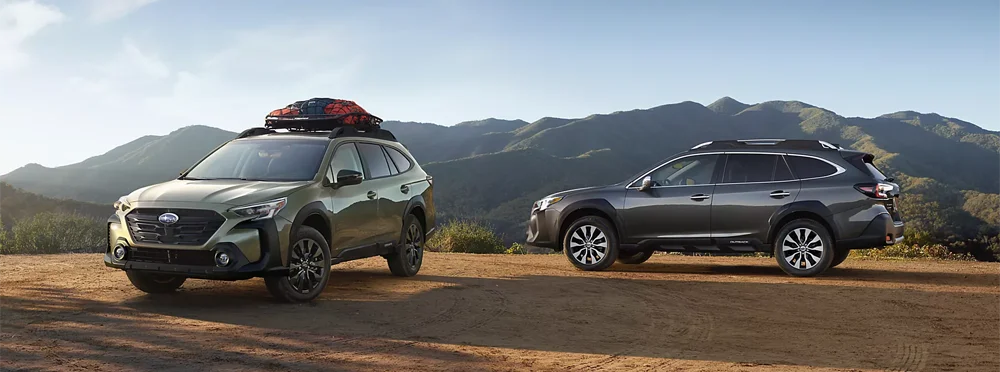 Two Outbacks Parked in front of Mountains