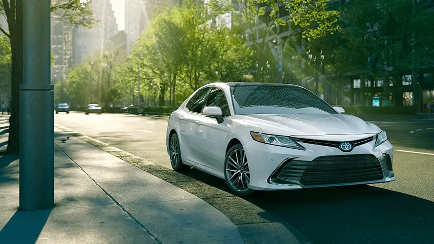2021 Toyota Camry driving down city street