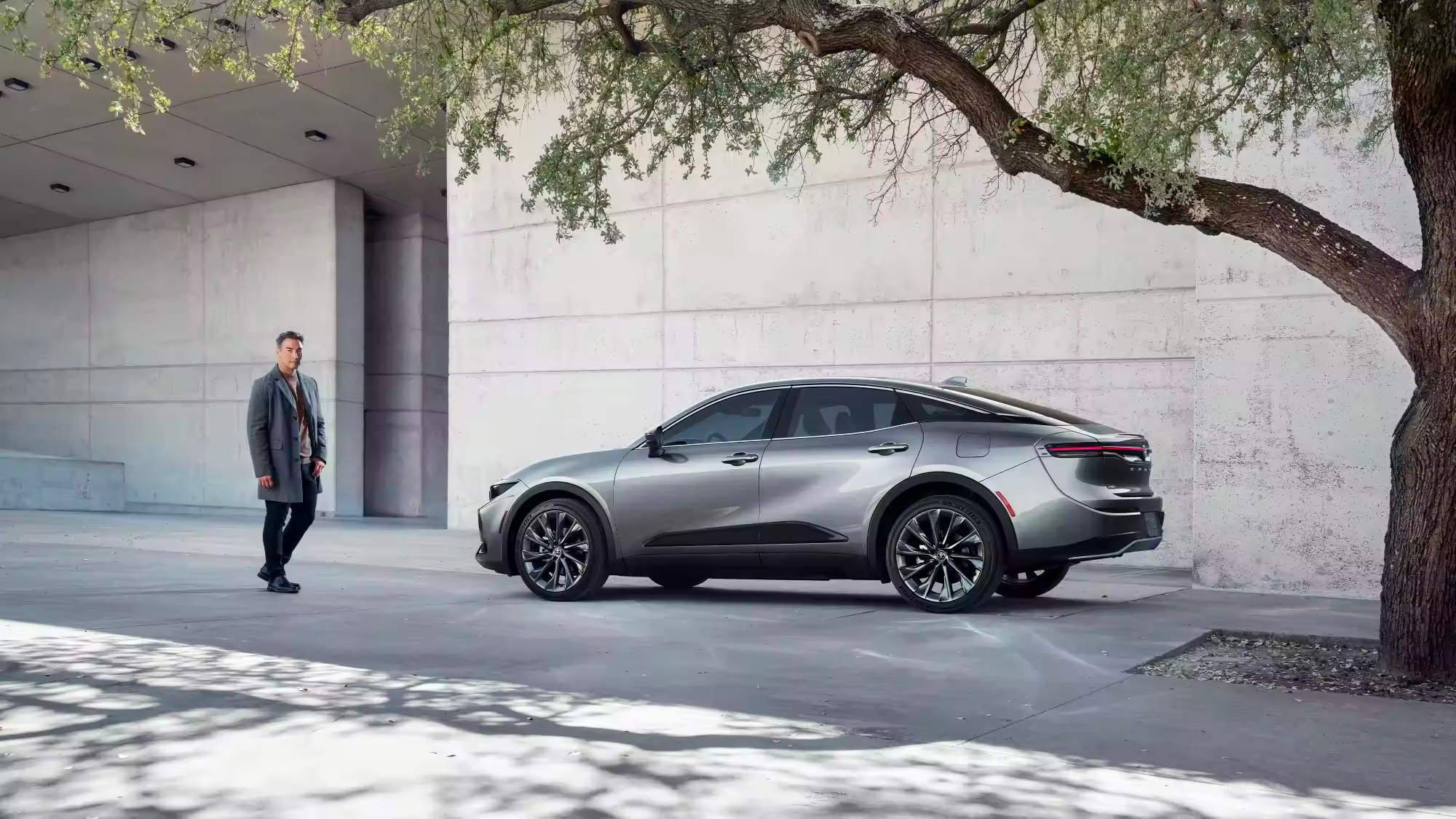 Crown Technology - person approaching Toyota Crown vehicle