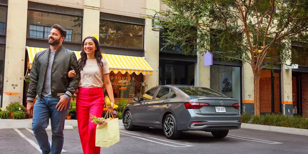 2022 VW Jetta driving in a suburban neighborhood